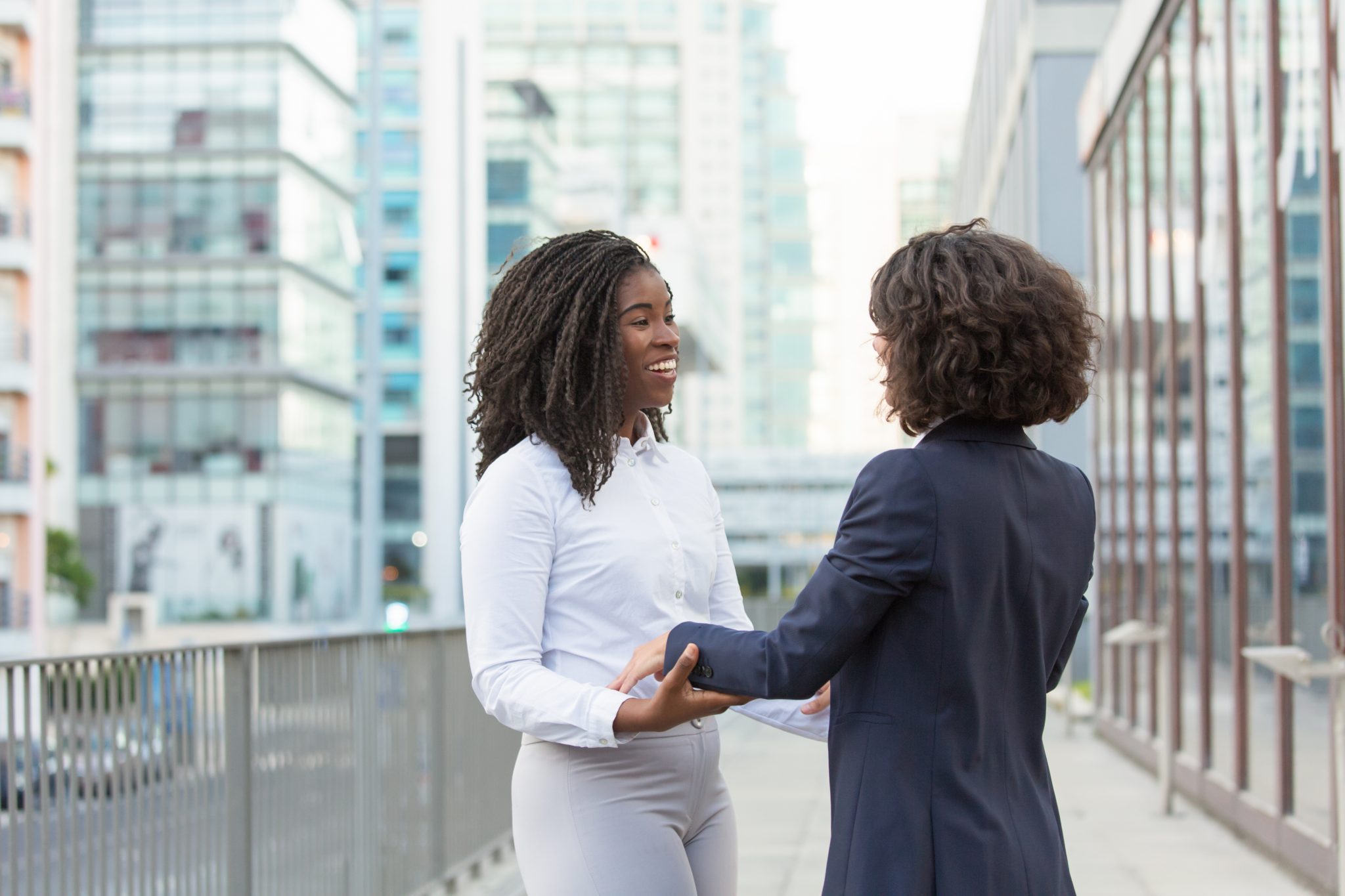 happy old female friends accidently meeting